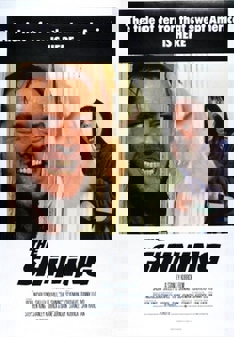 The poster for the movie The Shining, featuring a grinning Jack breaking down the bathroom door with an axe while a terrified Wendy brandishes a knife.